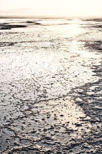 Scenic view of beach against sky during sunset