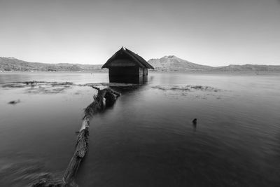 House by sea against sky