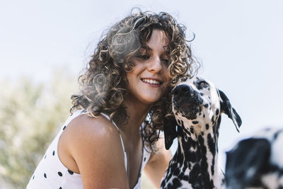 Portrait of smiling woman with dog