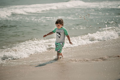 Full length of boy on beach