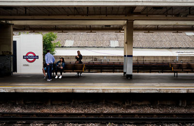 People waiting at railroad station platform