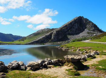 Scenic view of lake and mountains against sky