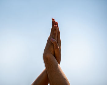 Low section of person against clear sky