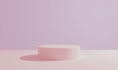 Close-up of empty glass on table against white background