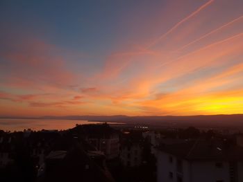 High angle view of buildings against sky during sunset