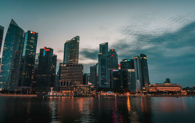 View of skyscrapers lit up in city