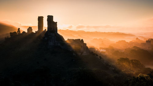 Castle against sky during sunset