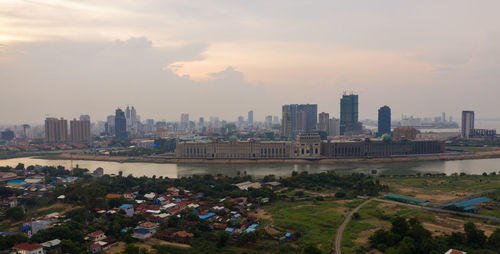 Aerial view of city buildings during sunset