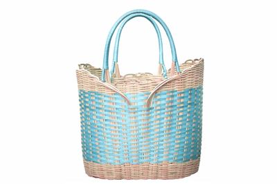 Close-up of wicker basket against white background