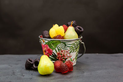 Close-up of fruits in bowl on table