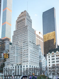 Modern buildings in city against sky