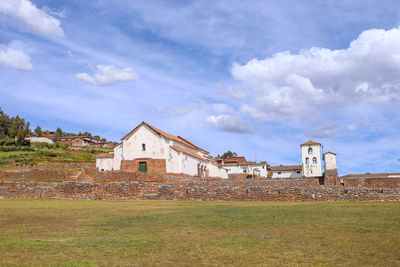 House on field against sky