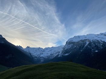 Scenic view of snowcapped mountains against sky