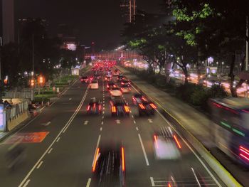 Traffic light trails on road in city at night