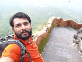 Portrait of smiling young man on mountain