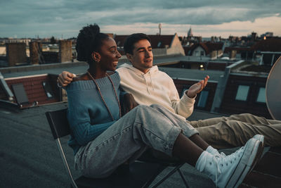 Young man sitting outdoors