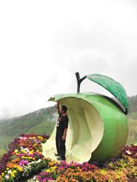 Man standing on field against sky