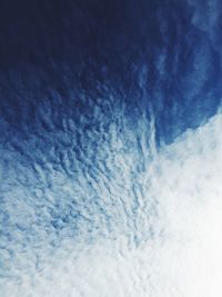 Low angle view of vapor trail in blue sky