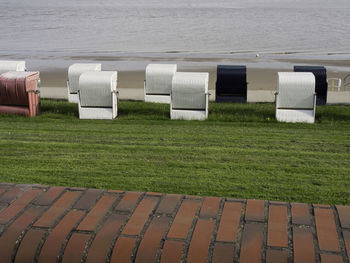 Row of hooded chairs on field