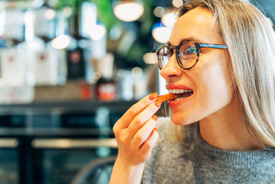 Close-up of young woman smoking cigarette