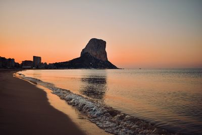 Scenic view of sea against clear sky during sunset