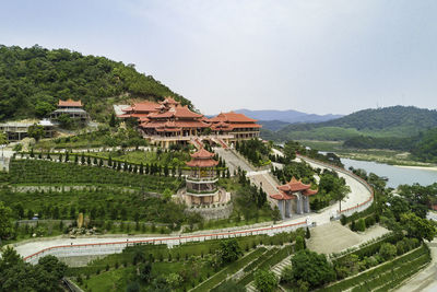 High angle view of trees and mountain against sky