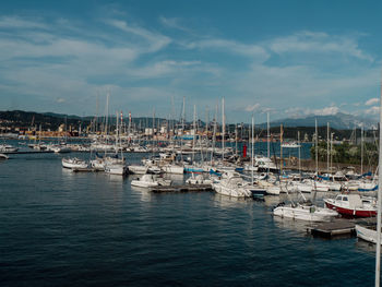 Boats moored at harbor