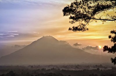 Scenic view of mountains against sky during sunset