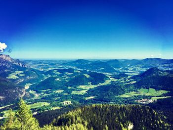 Scenic view of mountains against clear blue sky