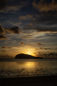 Scenic view of sea against sky at sunset