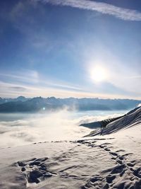 Scenic view of mountains against sky during winter