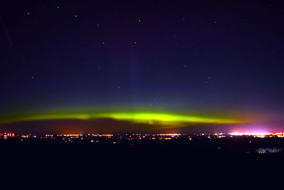Scenic view of illuminated sky at night
