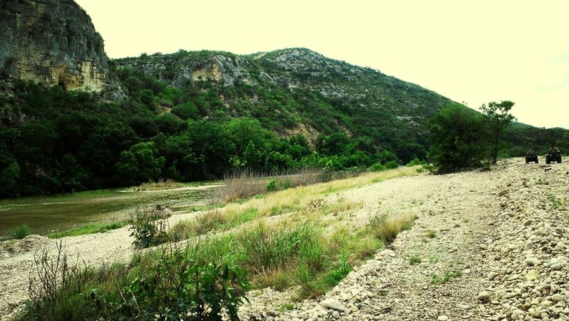 tranquil scene, tranquility, mountain, scenics, beauty in nature, nature, landscape, clear sky, tree, water, grass, non-urban scene, growth, plant, mountain range, idyllic, sky, rock - object, remote, rock formation