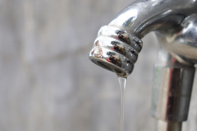 Close-up of water falling from faucet