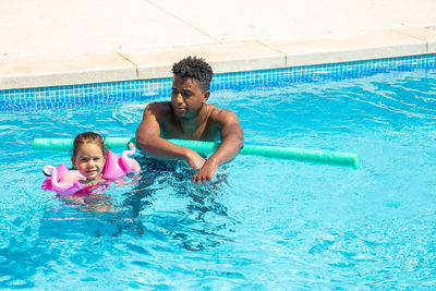 Young woman swimming in pool