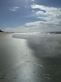 Scenic view of beach against sky