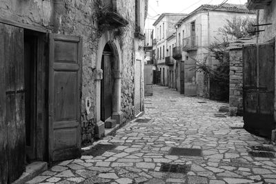 Footpath amidst buildings in town