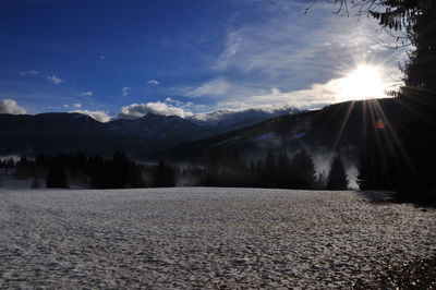 Scenic view of snow field against sky