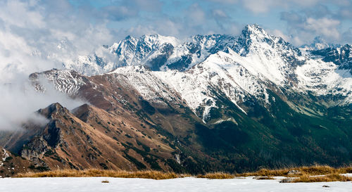 Scenic view of snowcapped mountains against sky