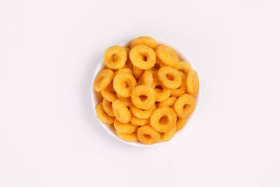 High angle view of bread in bowl against white background