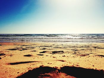 Scenic view of beach against clear sky