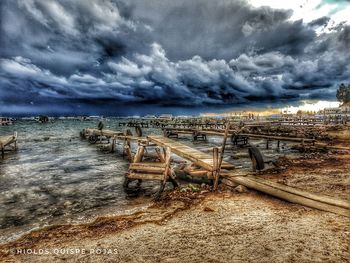 Scenic view of sea against cloudy sky