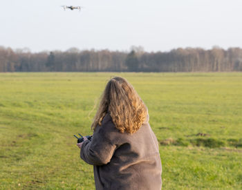 Rear view of horse on field