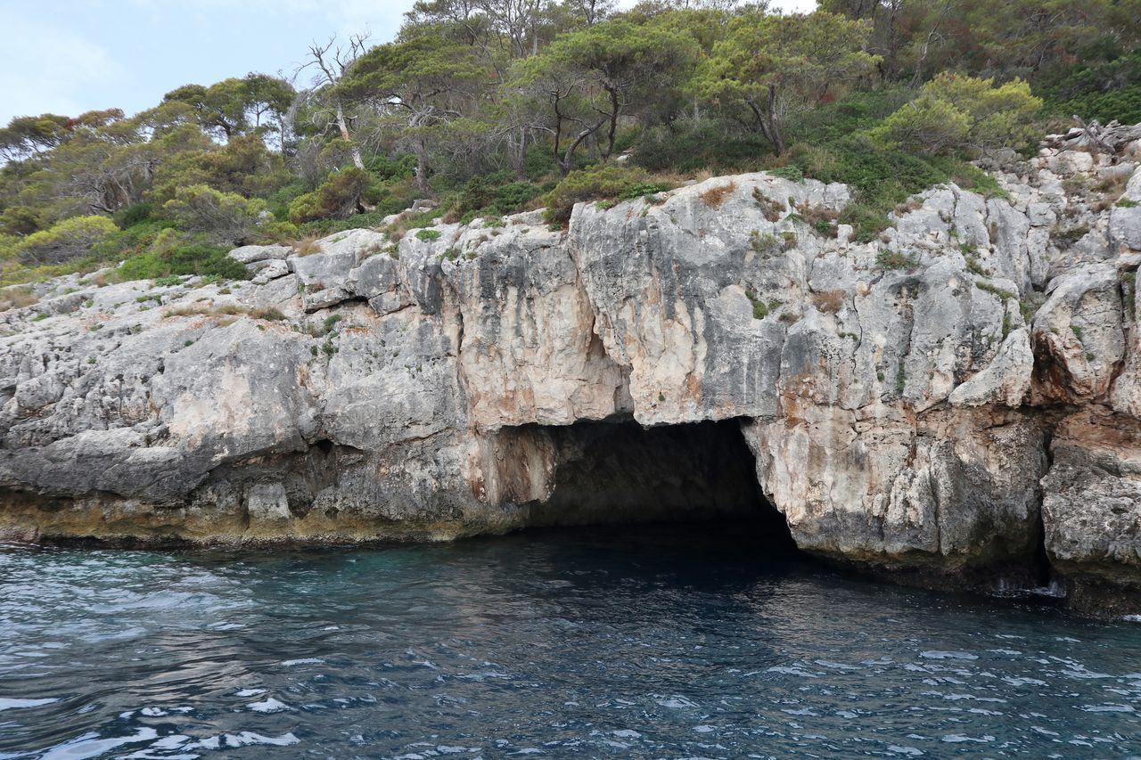 SCENIC VIEW OF SEA BY ROCKS