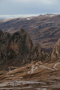 Scenic view of landscape and mountains against sky