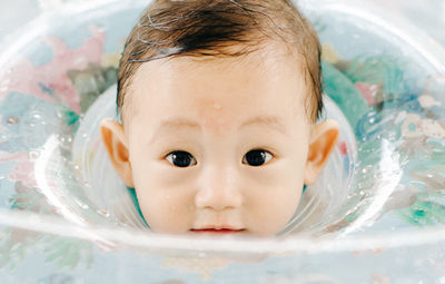 Close-up of boy playing with water