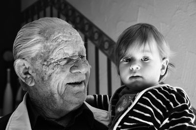 Close-up of grandfather with granddaughter