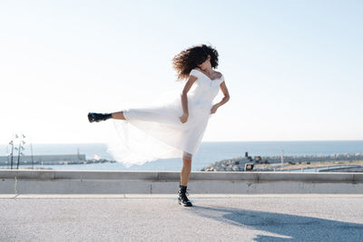 Full length of woman walking on beach