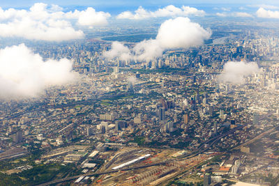 High angle view of buildings in city against sky