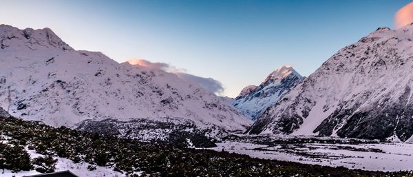 Scenic view of snowcapped mountains against sky